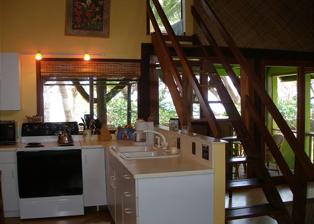 THE OHANA KITCHEN WITH STAIRWAY TO THE UPSTAIRS BEDROOM