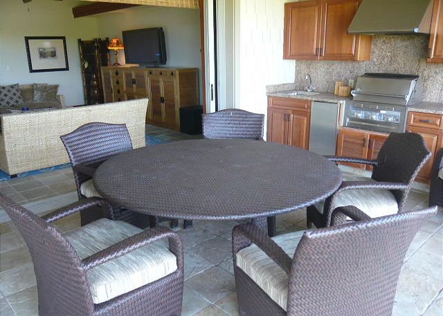 Enjoy dining on this 450 sq. ft. lanai with bar sink, fridge, an