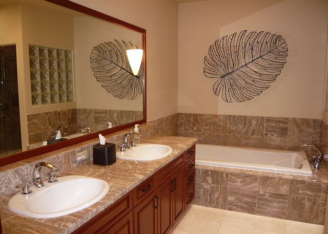 Downstairs bedroom with a queen bed & adjoining bath.