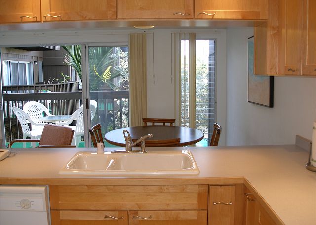 Kitchen looking out to the dining and lanai.
