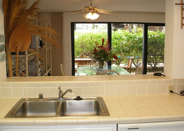 Kitchen with view of cabana and lanai