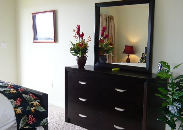 Master Suite with a flat screen TV & comfortable chair