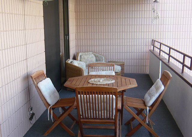 Lanai with a view of the pool & a peek-a-boo view of Magic Sands