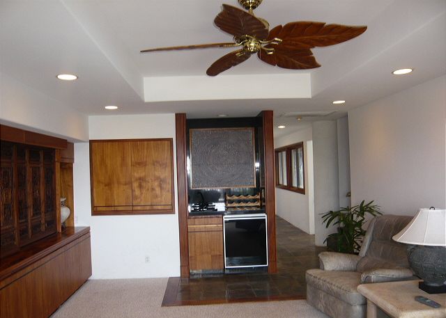 Living area off with television and ocean view.