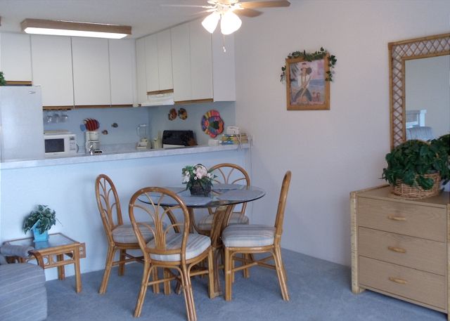 Dining room into the kitchen. View the coast line from this livi