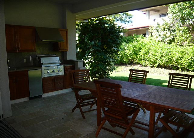 Lanai off the living room with BBQ and wet bar.