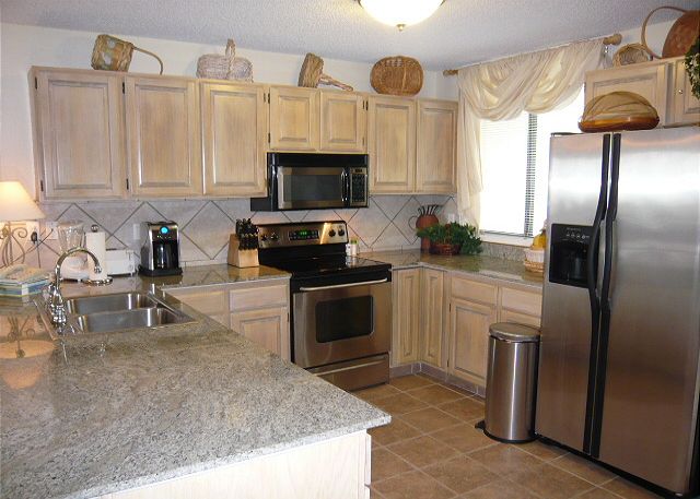 Kitchen with granite and upgraded appliances.