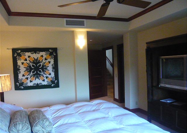 One of the downstairs bedrooms with a lanai off the end.