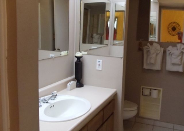 Full bath with a shower stall.