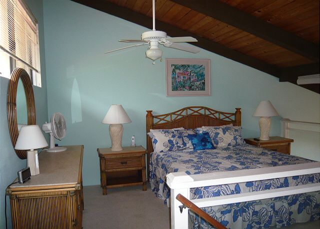 Loft bedroom with an adjoining bath.