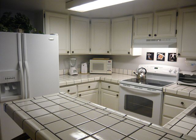 Fully equipped kitchen with new fridge & stove.