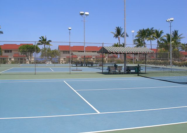 Tennis courts with lights for evening enjoyment.