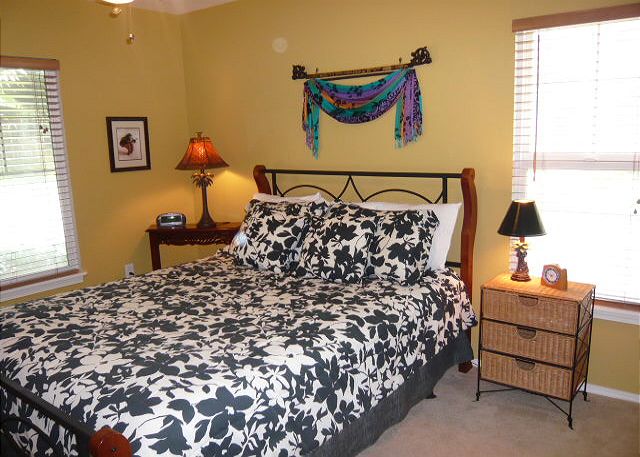 Downstairs bedroom with a queen bed.