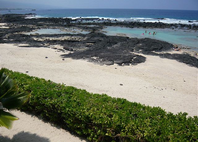 Sandy beach area directly behind the house.