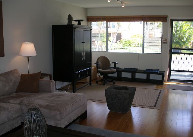 Spacious entry way with a comfortable working office space and h