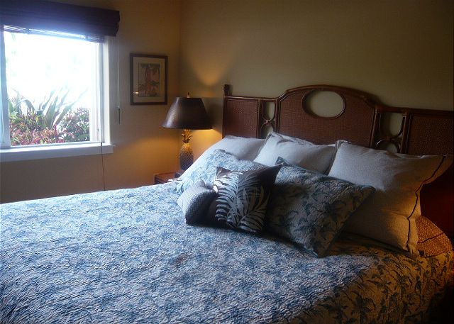 Bedroom with a king bed and ocean view.