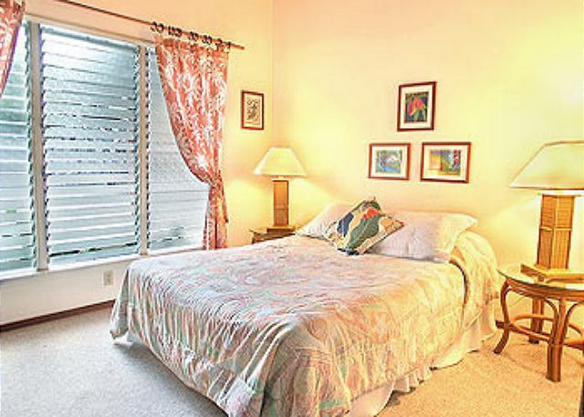 One of the four bedrooms this one with a queen bed.