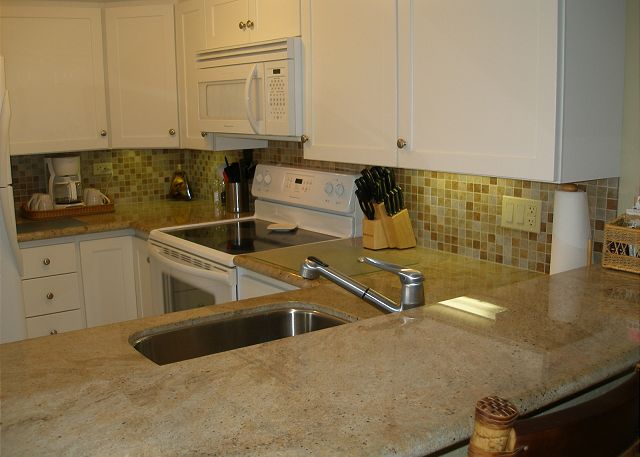 Beautiful gourmet kitchen with granite, new easy sliding cabinet