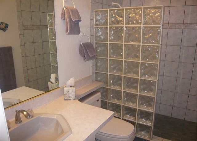 Bathroom with a shower stall.