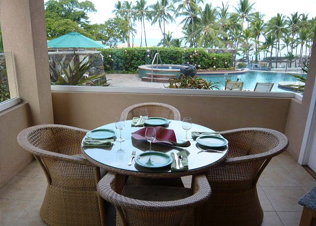 Lanai dining with an ocean view.