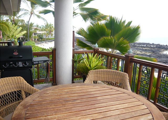 Lanai with BBQ and an ocean front view.