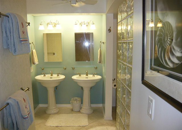 Totally remodeled bathroom with pedestal sinks