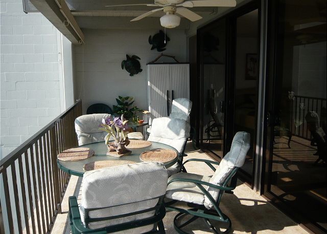 Spacious tiled lanai with a full on ocean view & pull down sun s