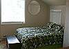 This is the queen bed in the upstairs first bedroom.