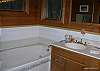 Main floor bathroom with bathtub and shower