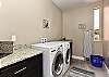 The laundry room has a washer, dryer, iron, ironing board and is stocked with laundry detergent if you desire to wash your clothes during your stay