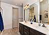 The Main bathroom that is adjacent to the Main bedroom is large and luxurious. With his and her sinks, toilet, vanity, walk-in shower, large bathtub and a large walk-in closet.