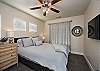 Bedroom 2 is furnished with a Queen size bed and inculdes a private TV, night stands, lamps, and ceiling fan.