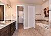 The Main Bathroom includes his and her sinks, walk-in shower, and full-size bathtub.