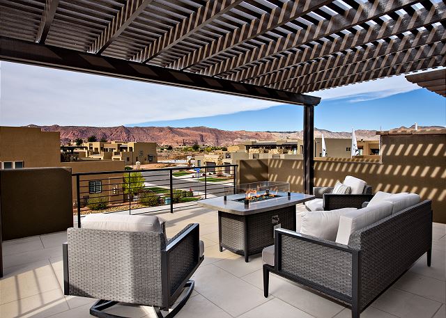 Stay warm next to the fire pit and relax while watching the sunset over the red mountains.
