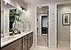 The master bathroom that is adjacent to the master bedroom is large and luxurious. With his and her sinks, toilet, vanity, walk-in shower, large bathtub and a large walk-in closet.