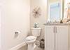 This beautiful half bathroom is located downstairs for your convenience. 