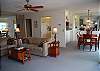 Living room, dining room and kitchen, all with lake view
