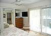 Master bedroom with king bed and private deck