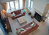 Living room with fireplace and lake view