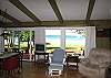Living room and dining room, both with lake views