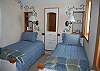 3rd bedroom with two twin beds on second floor