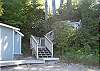 Lakeside cabana/bathroom and steps leading up to the house
