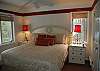 Master bedroom with king bed and air conditioning