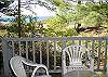 Deck off of living room with lake view