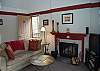 Living room with fireplace and sofa bed