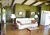 Living room with hardwood floors and lake view