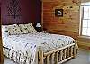 3rd bedroom with queen bed on the lower level
