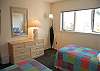 3rd bedroom with two twin beds and lake view on second floor