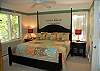 Master bedroom with king bed and air conditioning