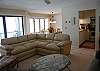 Living room, dining room and kitchen, all with lake view
